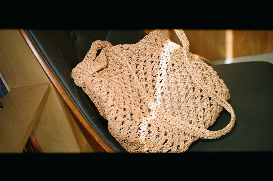 A crocheted raffia market bag